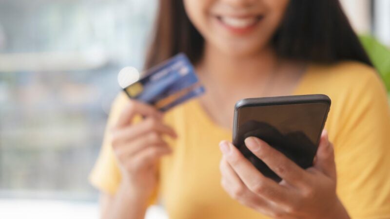 business woman holding smartphone with credit card 2021 09 03 02 17 30 utc 800x450 1